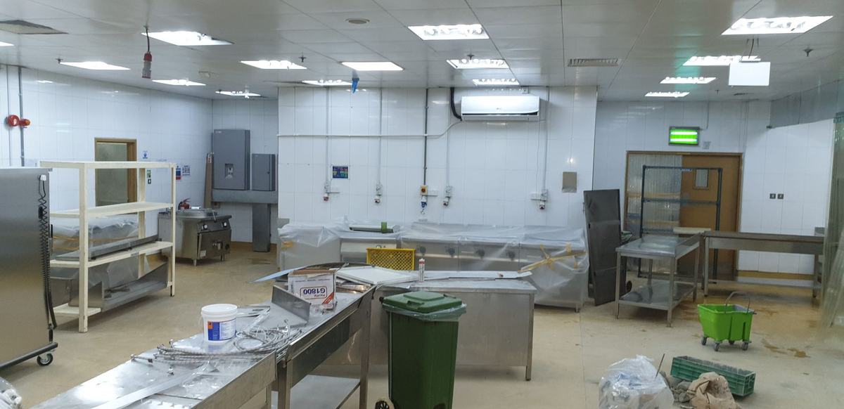 Kitchen taking shape with stainless steel prep lines